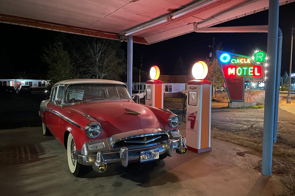 Vintage car and neon motel sign at Circle R Motel in Salida, Colorado.